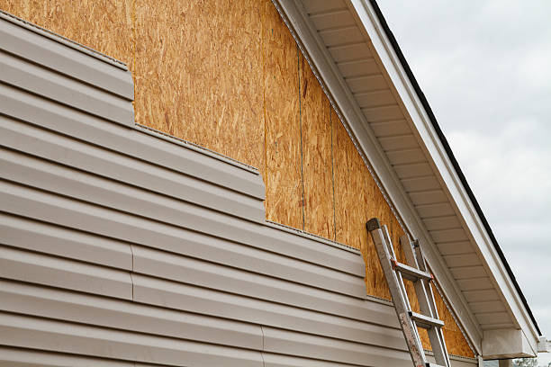 Professional Vinyl Siding technician working in Bayville, NY